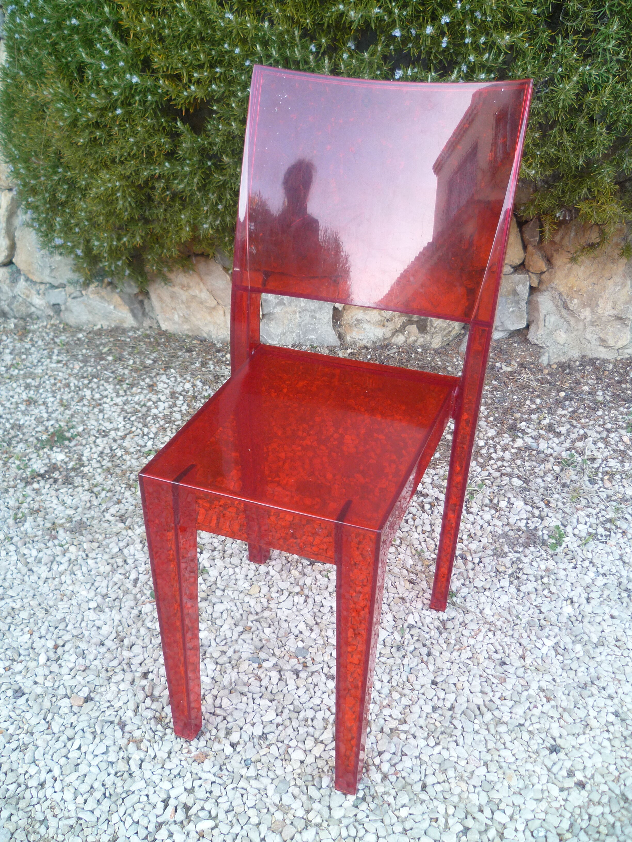 Orange design chair in polycarbonate plexiglass