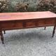 Old farmhouse table with cherry and chestnut panels with 3 drawers.