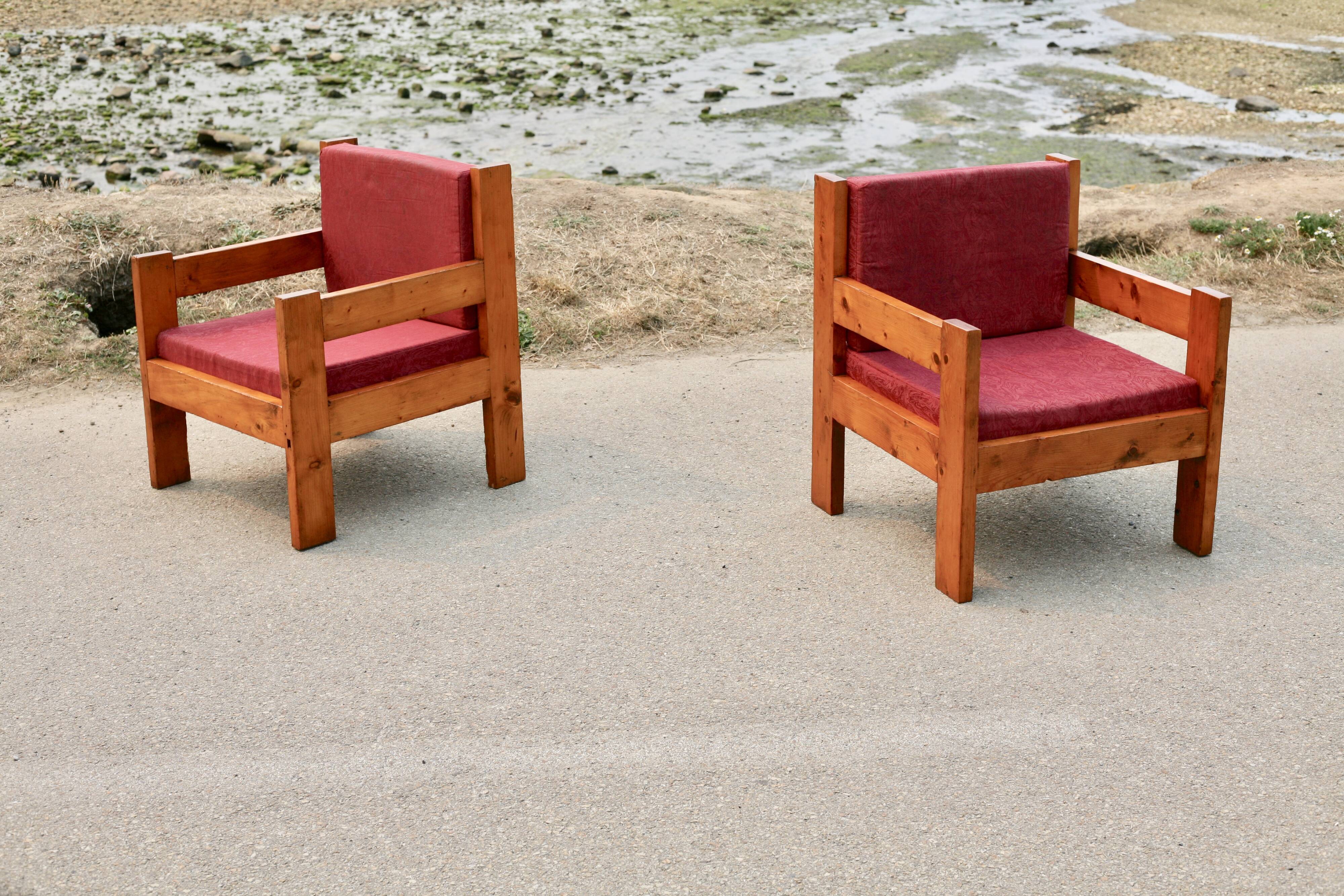 Pair of pine fireside chairs, France, 1960s, "raspberry" cushions