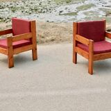 Pair of pine fireside chairs, France, 1960s, "raspberry" cushions
