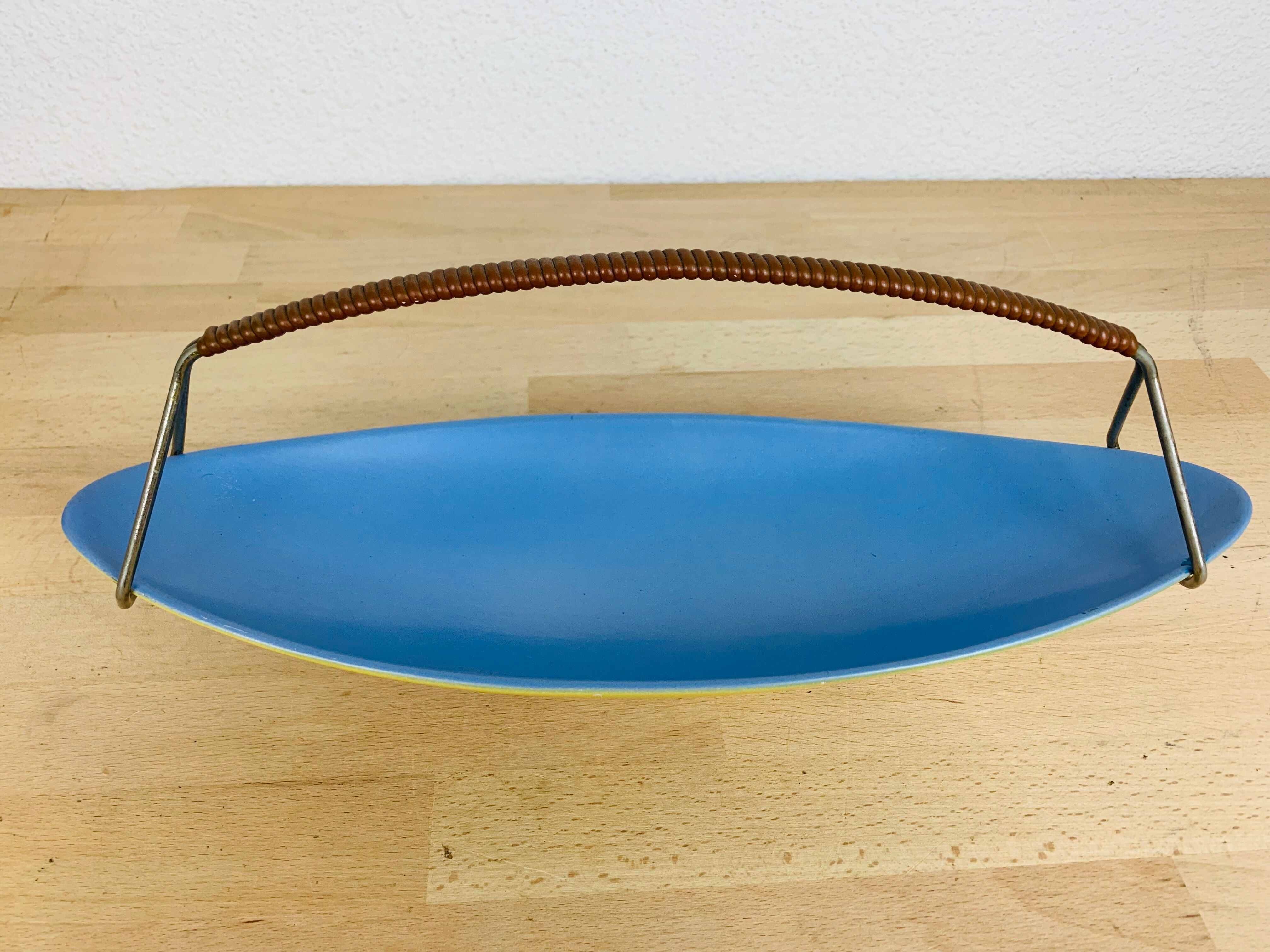 Empty ceramic shuttle pocket from the 50s