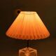 Minimalist glass table lamp from the 80s with a pleated shade.