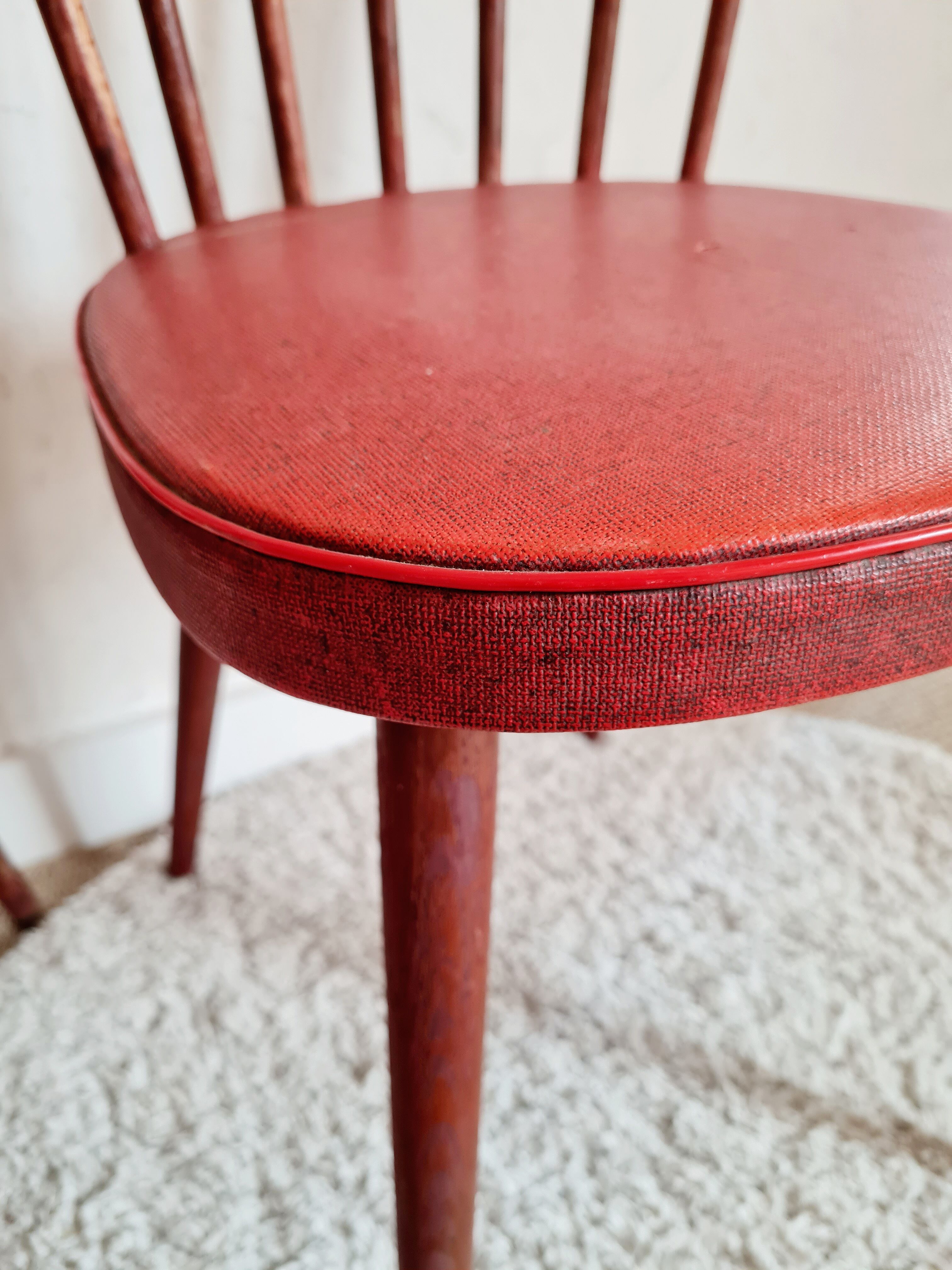 Pair of wooden bistro chairs and red imitation seating