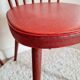 Pair of wooden bistro chairs and red imitation seating