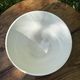 Old footed bowl in earthenware with pink decoration and defects.