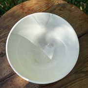 Old footed bowl in earthenware with pink decoration and defects.