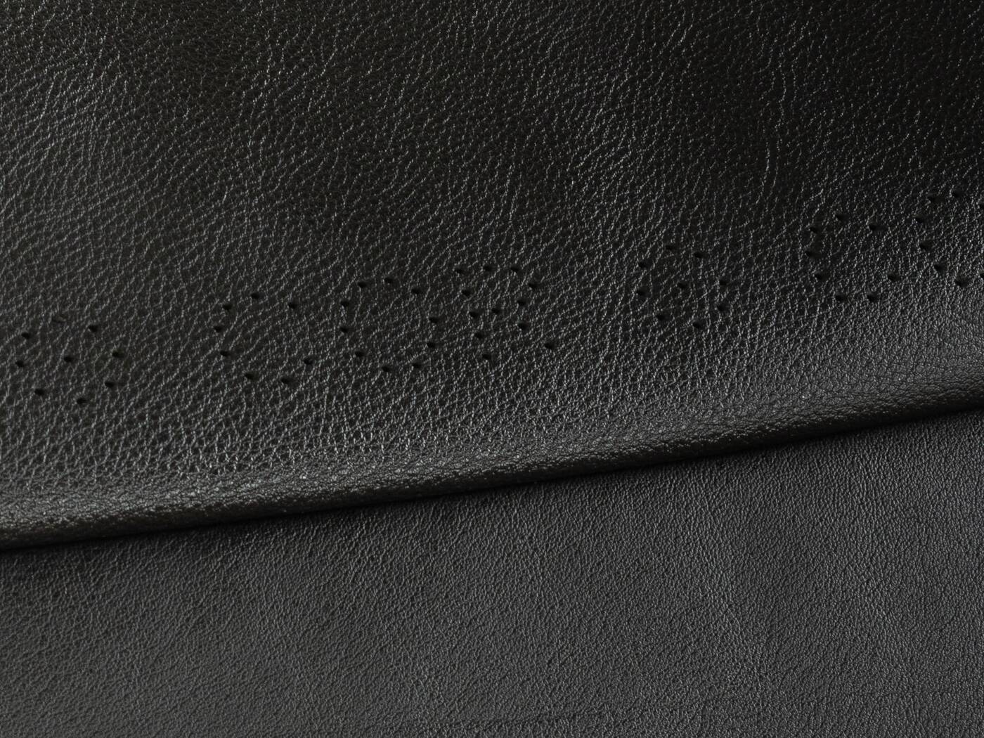 1980s cor armchair and ottoman in black leather