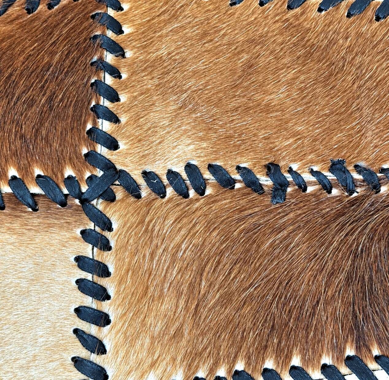 Tapis en patchwork de cuir de vache à lacets / années 1980