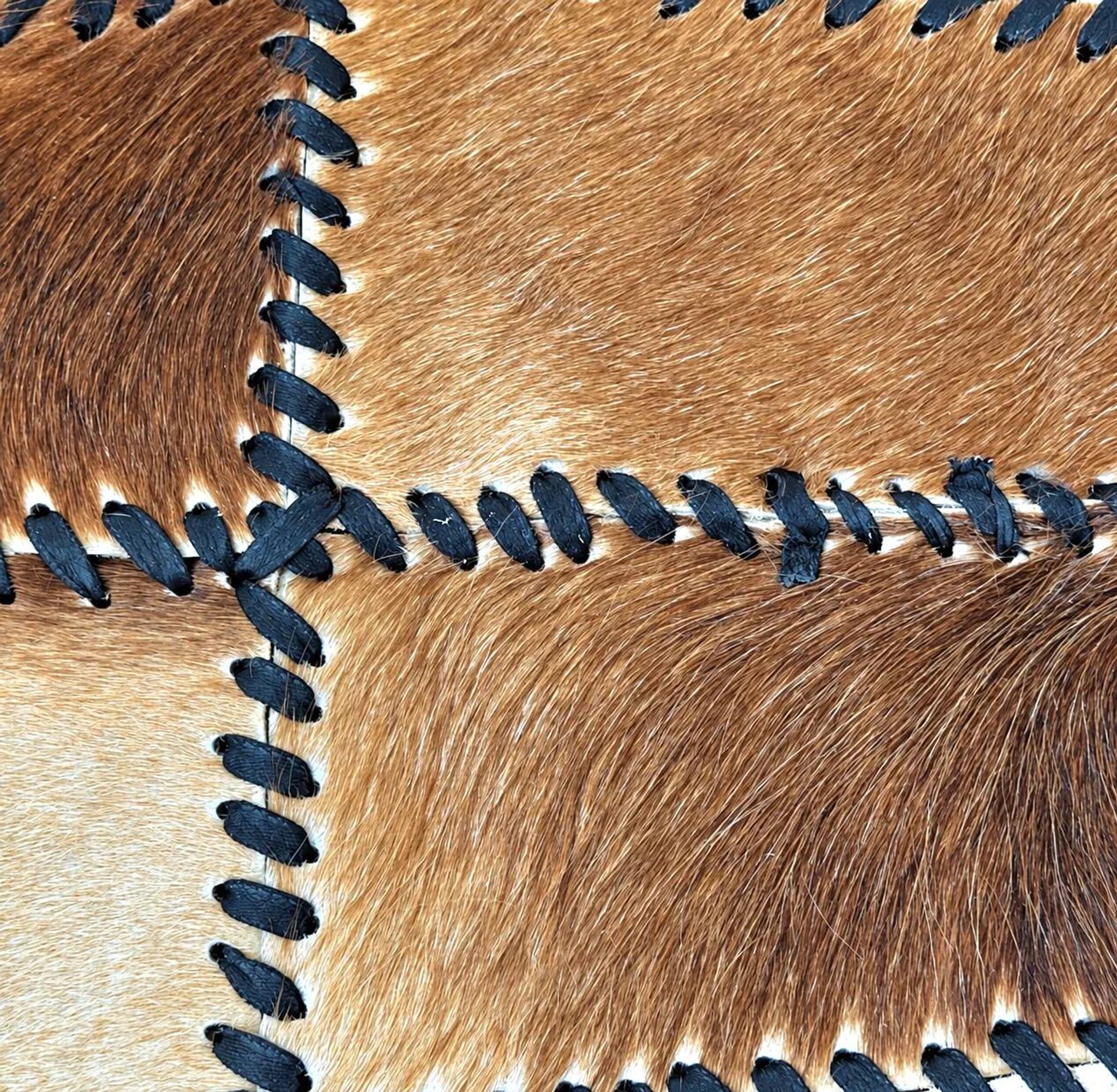 Tapis en patchwork de cuir de vache à lacets / années 1980