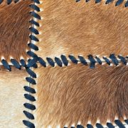 Tapis en patchwork de cuir de vache à lacets / années 1980