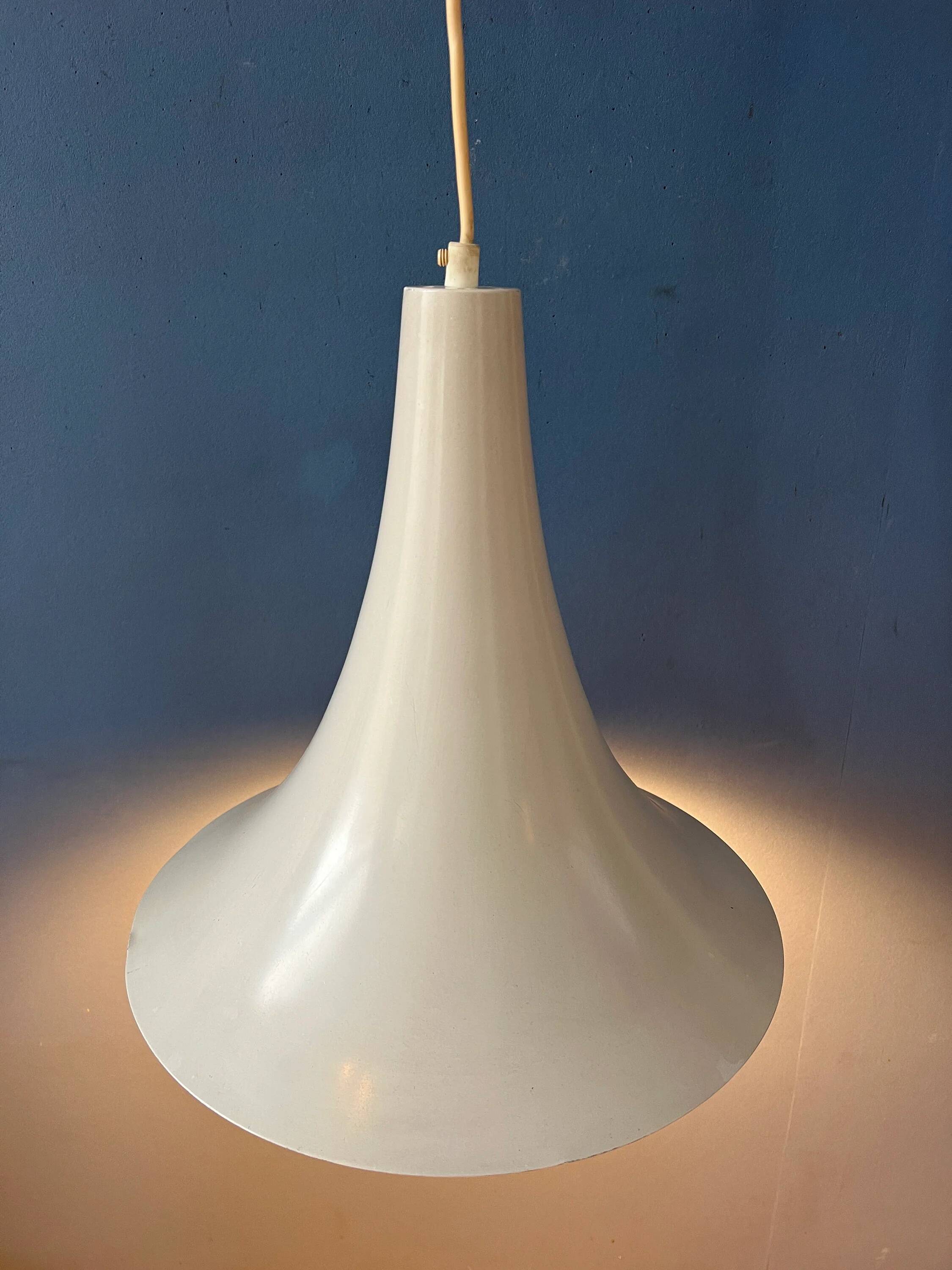 Small vintage beige pendant light in the shape of a witch's hat.