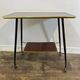 Vintage side table, brass gallery and wheels, 1950s.