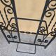 Large vintage wall coat rack in wrought iron with mirror and shelf.
