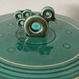 Green cermal pot decorated with bird