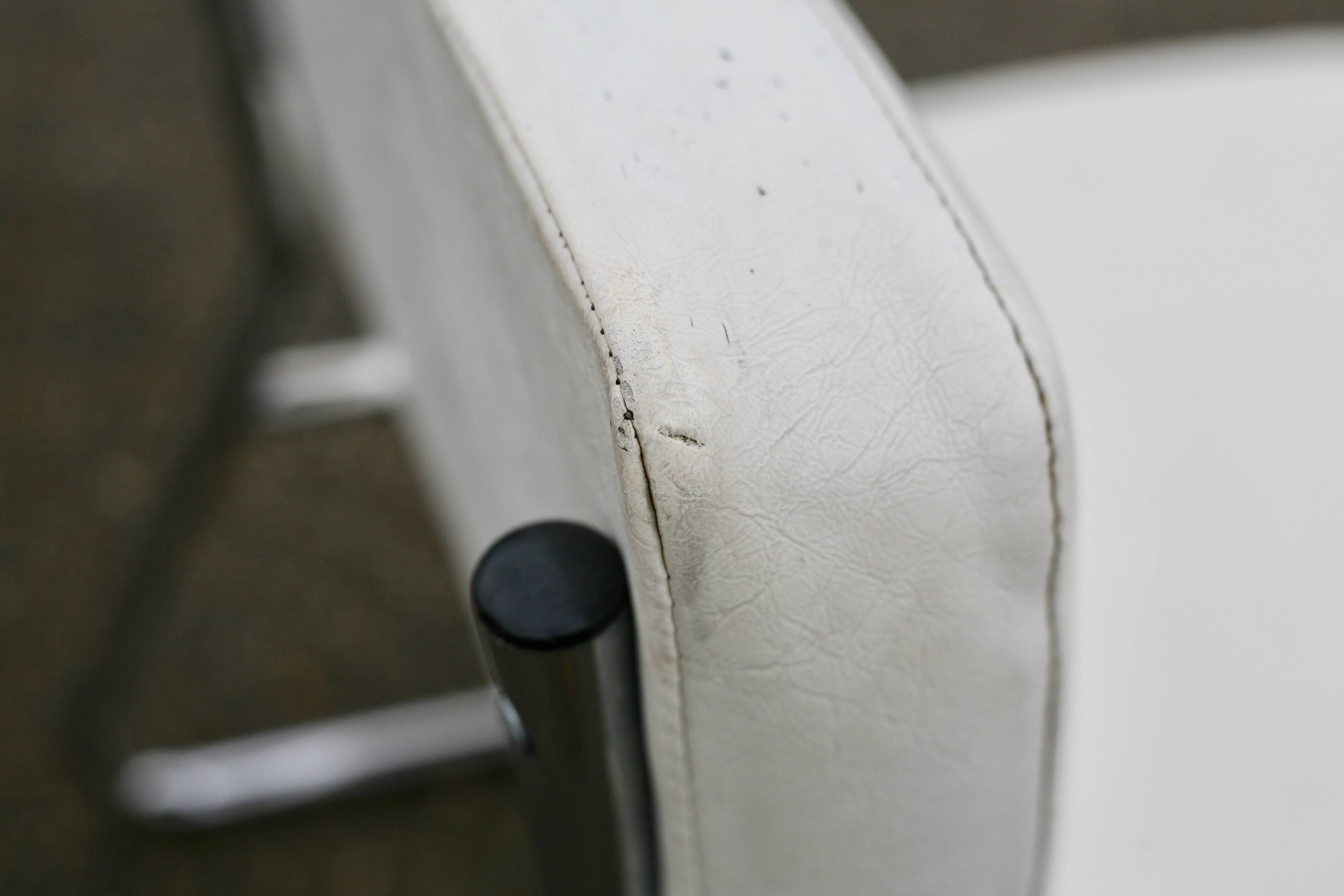 4 armchairs forming a modular sofa. Steel, imitation leather, 70s