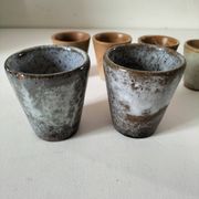 Set of 8 stoneware cups and a mug, shades of beige.