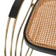 Modernist rocking chair in gilded brass and cane.