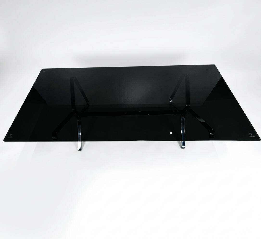 Smoked glass and chrome table design – Italian style from the 1970s.