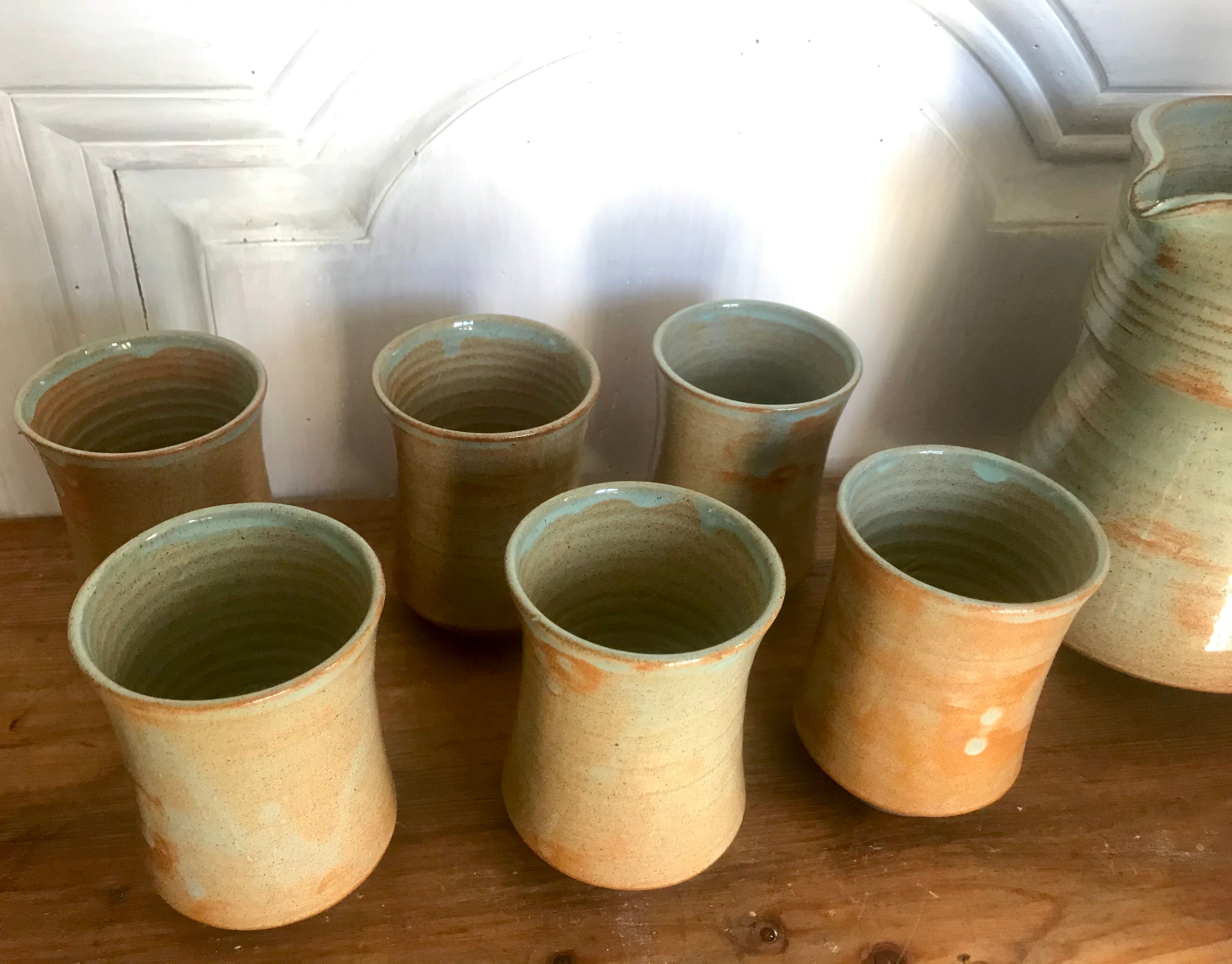 Pitcher and its vintage sandstone glasses