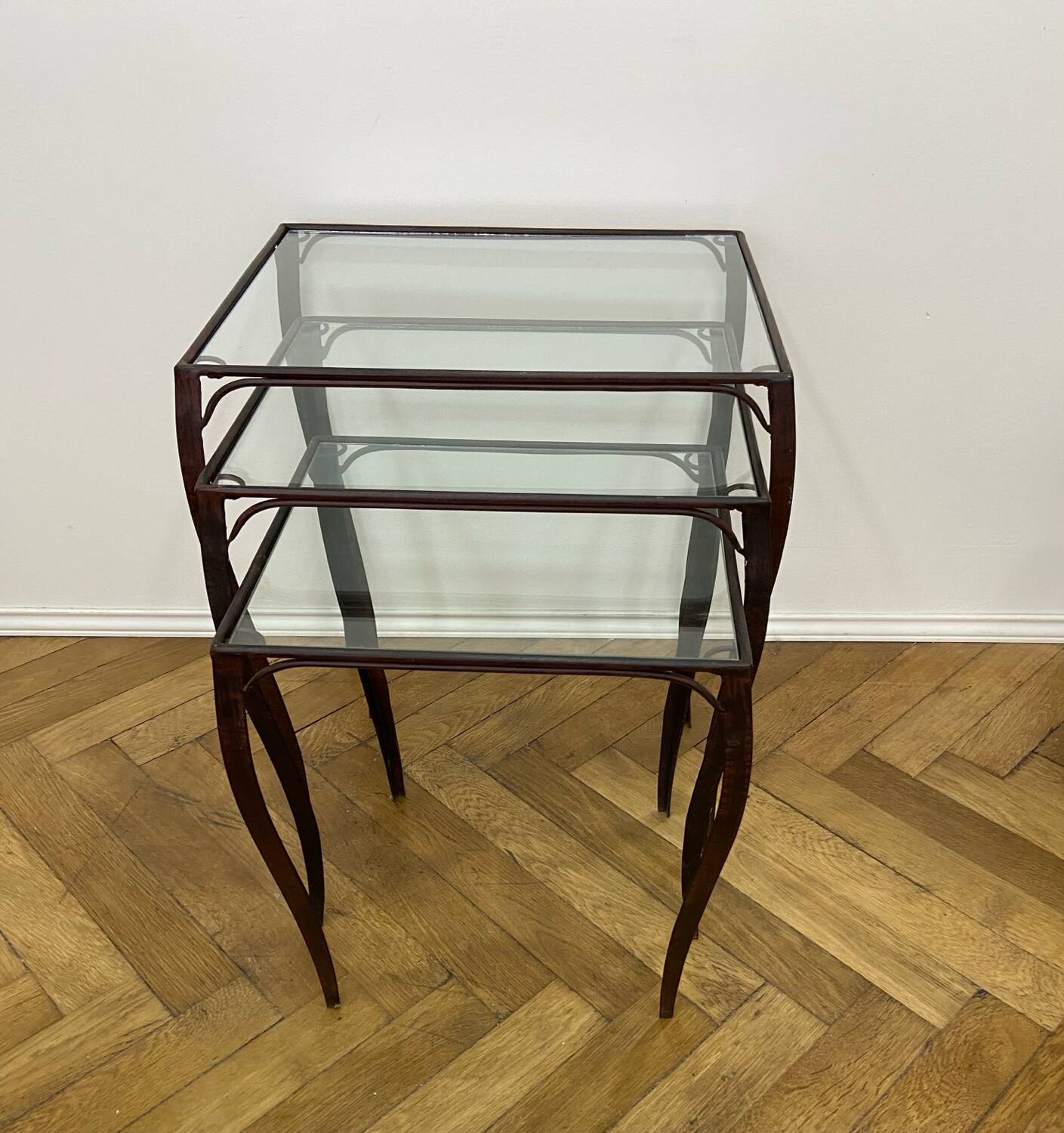 Nesting tables in wrought iron and glass