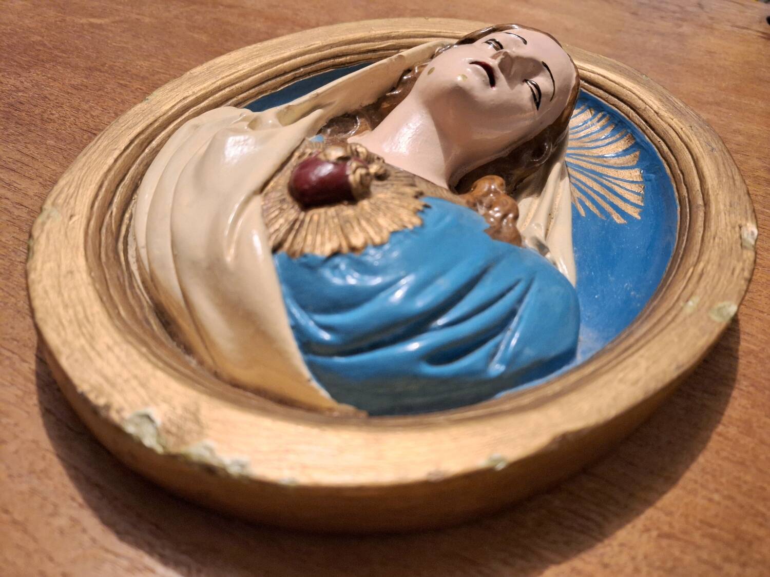 Vintage plaster frame of the Virgin, old religious painting