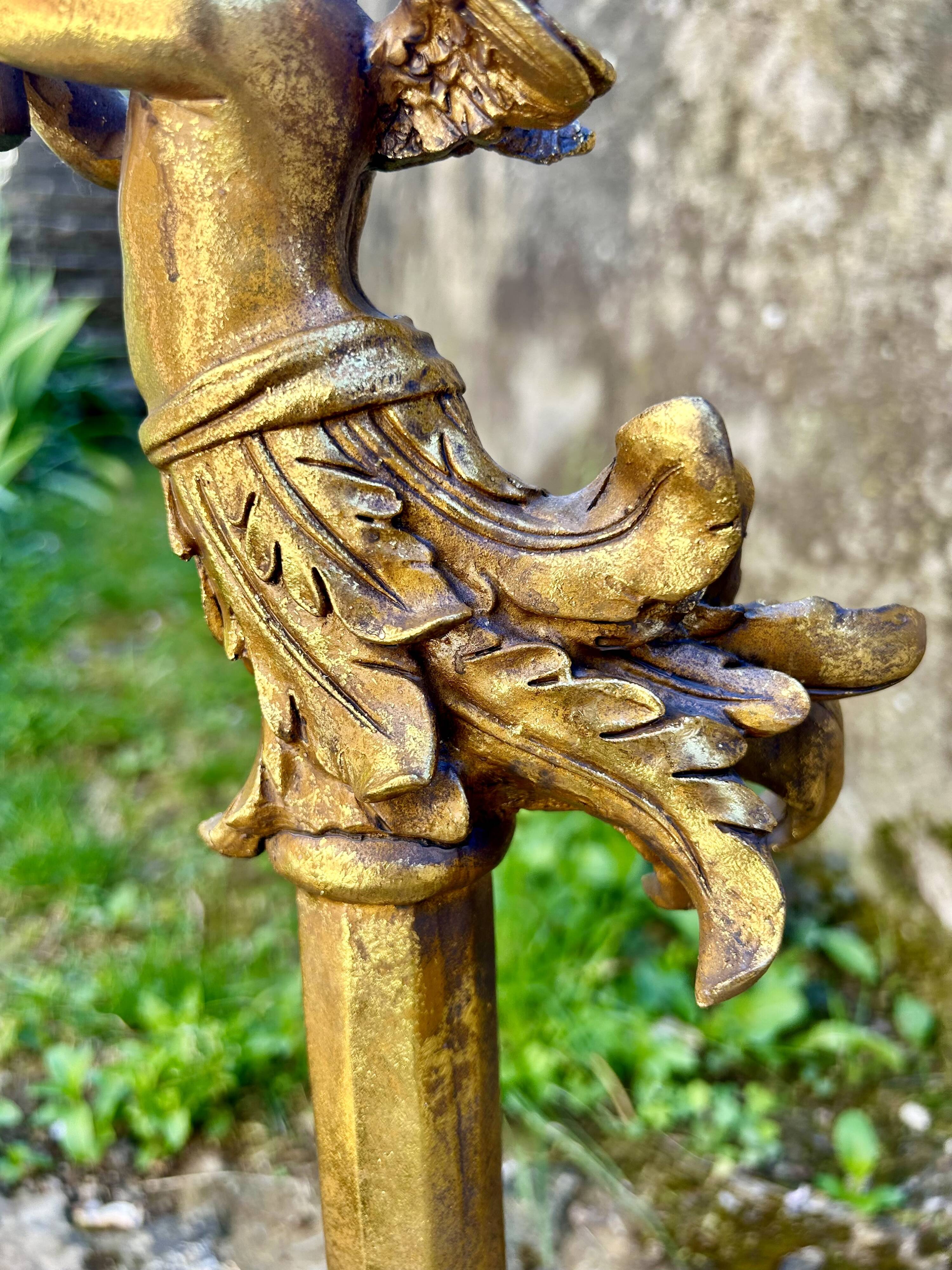 Pair of large candlesticks with cherubs