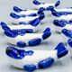 Set of 11 vintage blue and white porcelain fish knife rests.