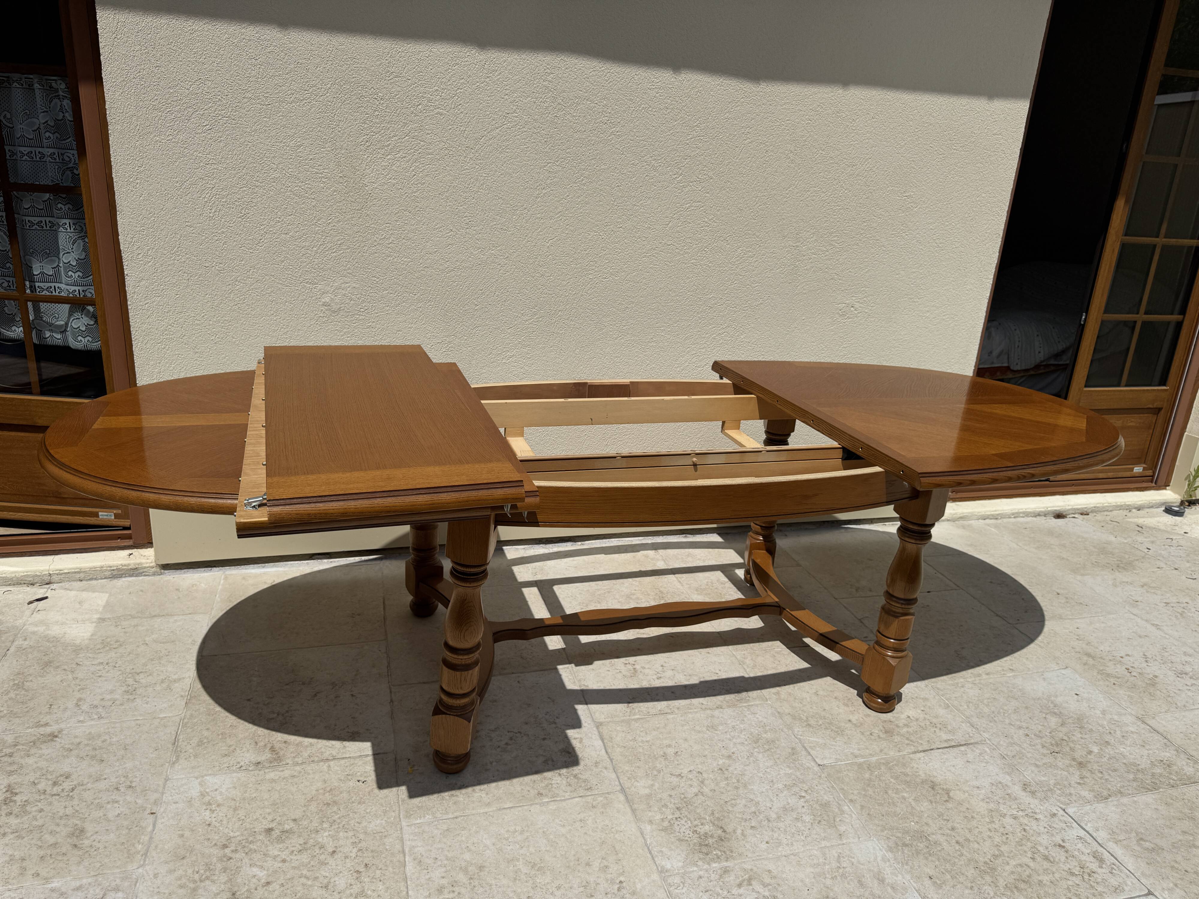 Oak dining table, oval living room table with two extensions.