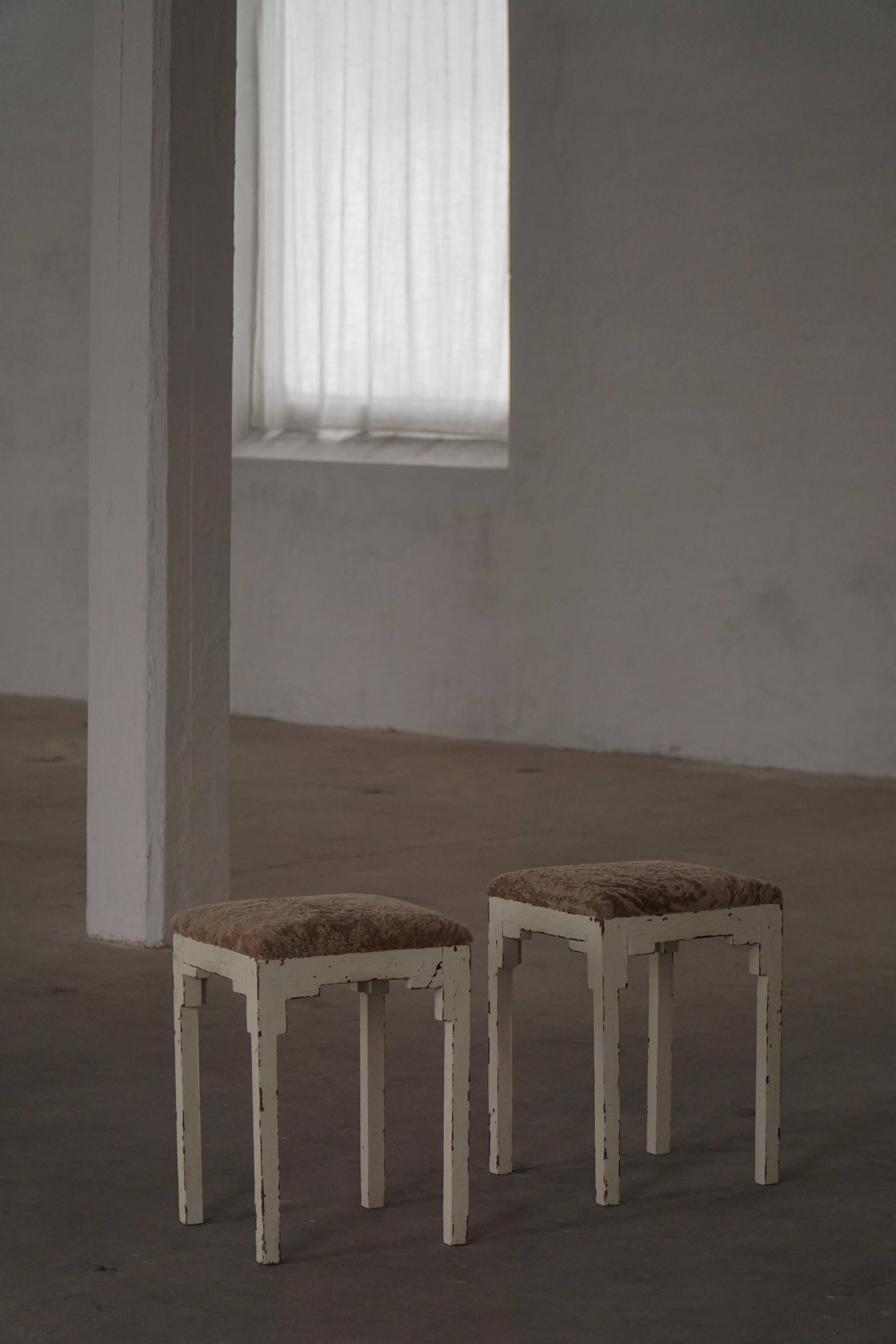 A pair of antique Danish stools, seats in lambswool, late 19th century.