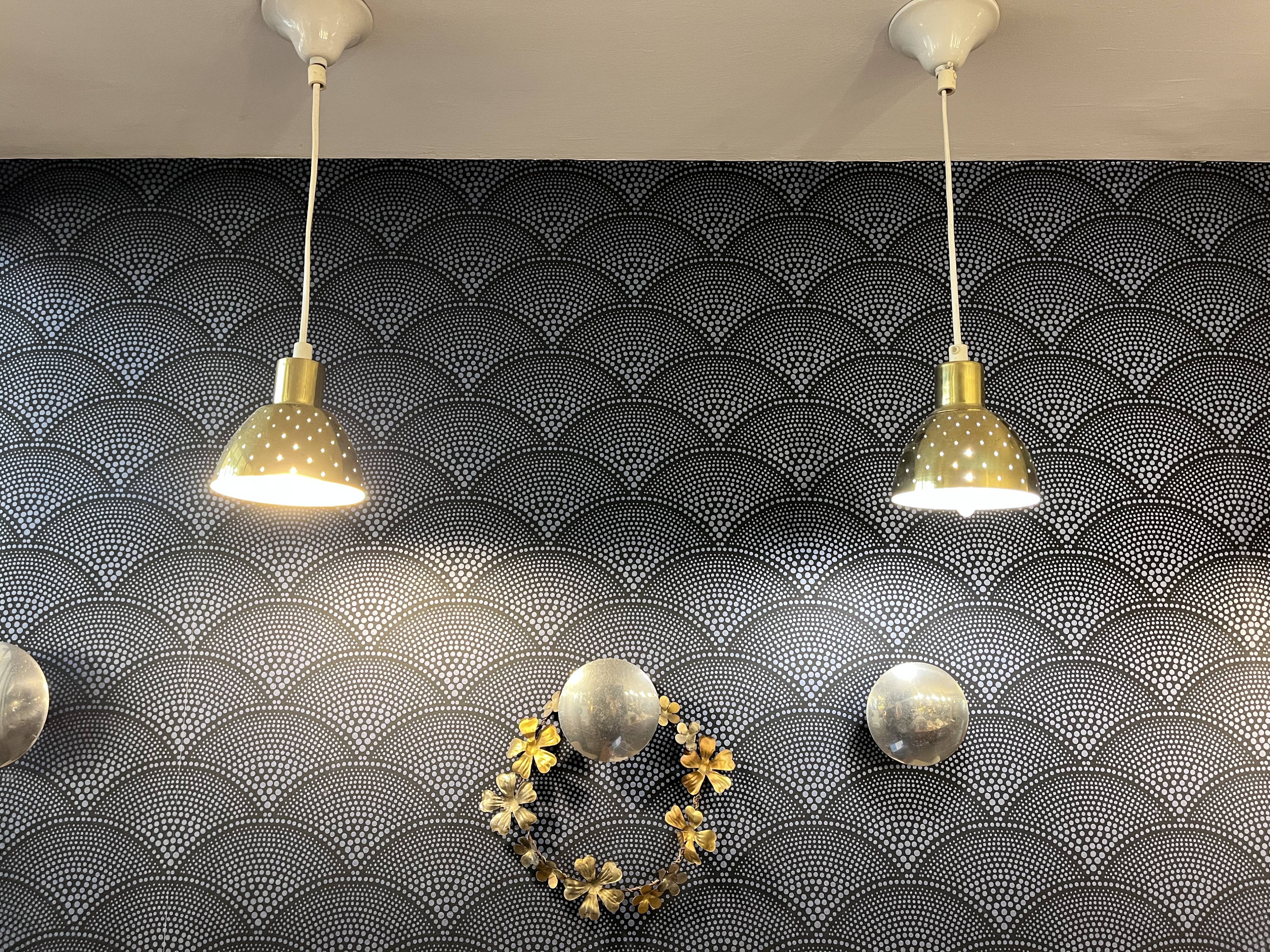 Pair of vintage 1970s gold perforated metal pendant lights. 6 lots.