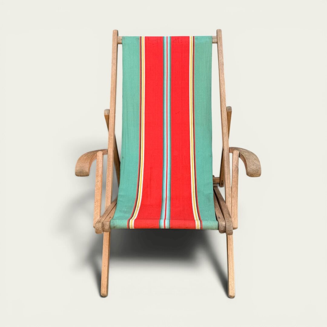 Vintage deck chair with striped green and red fabric, original patina.