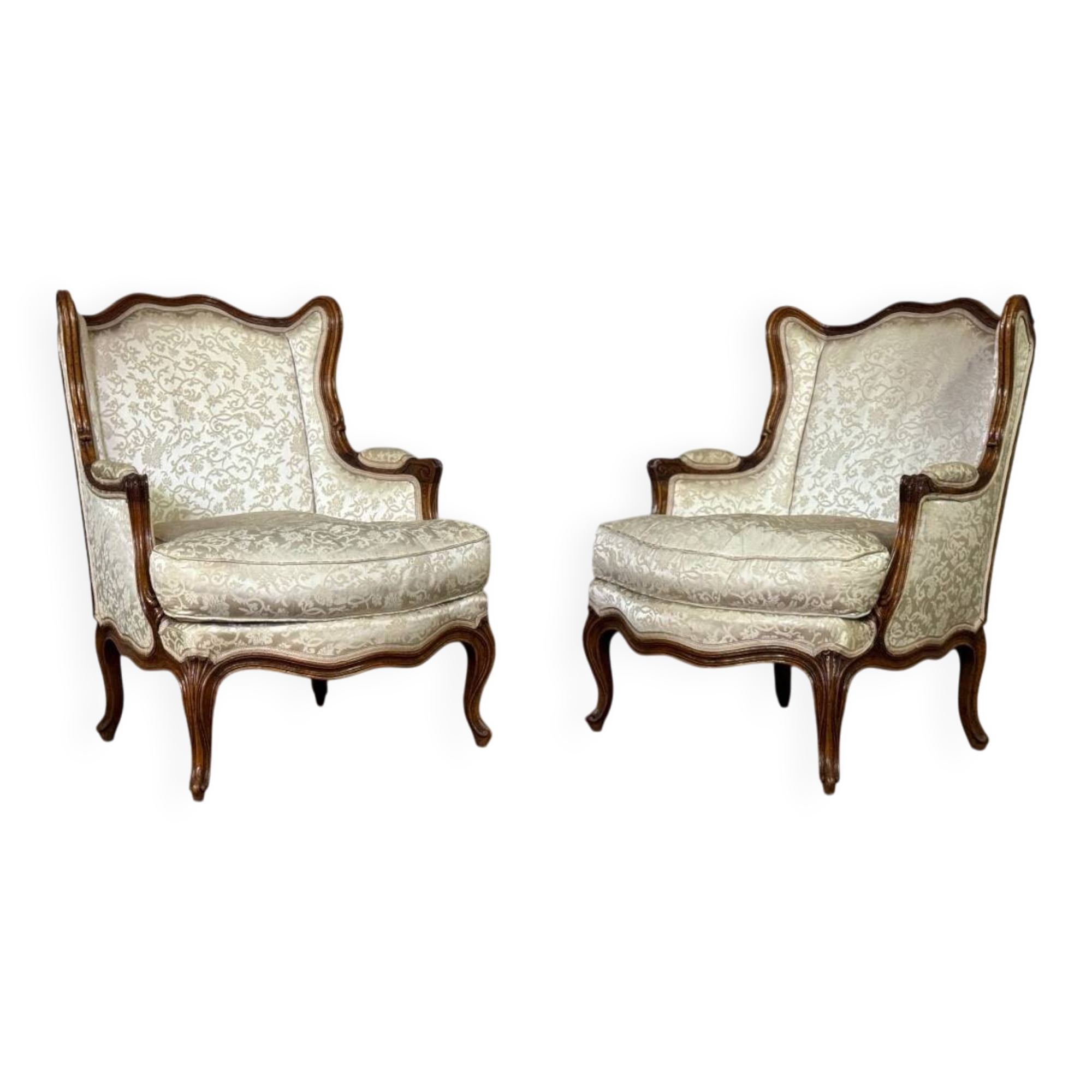 Pair of small Louis XV style wing chairs in carved walnut, Bosson stamp