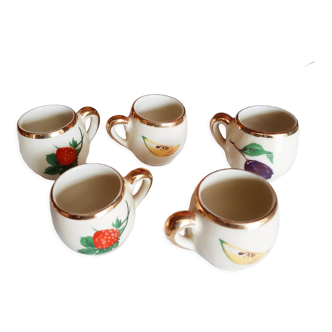 5 antique cups with liquor, porcelain fruits