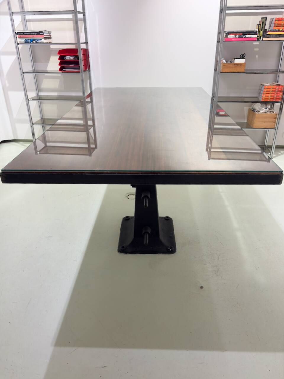 Industrial table with cast iron legs.