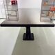 Industrial table with cast iron legs.