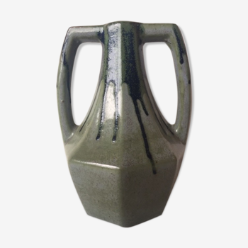 Ancient amphora vase in sand