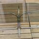 Vintage coffee table with metal tube structure and glass top.