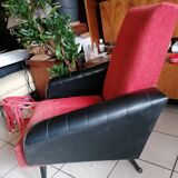 Red and black chair with brass feet