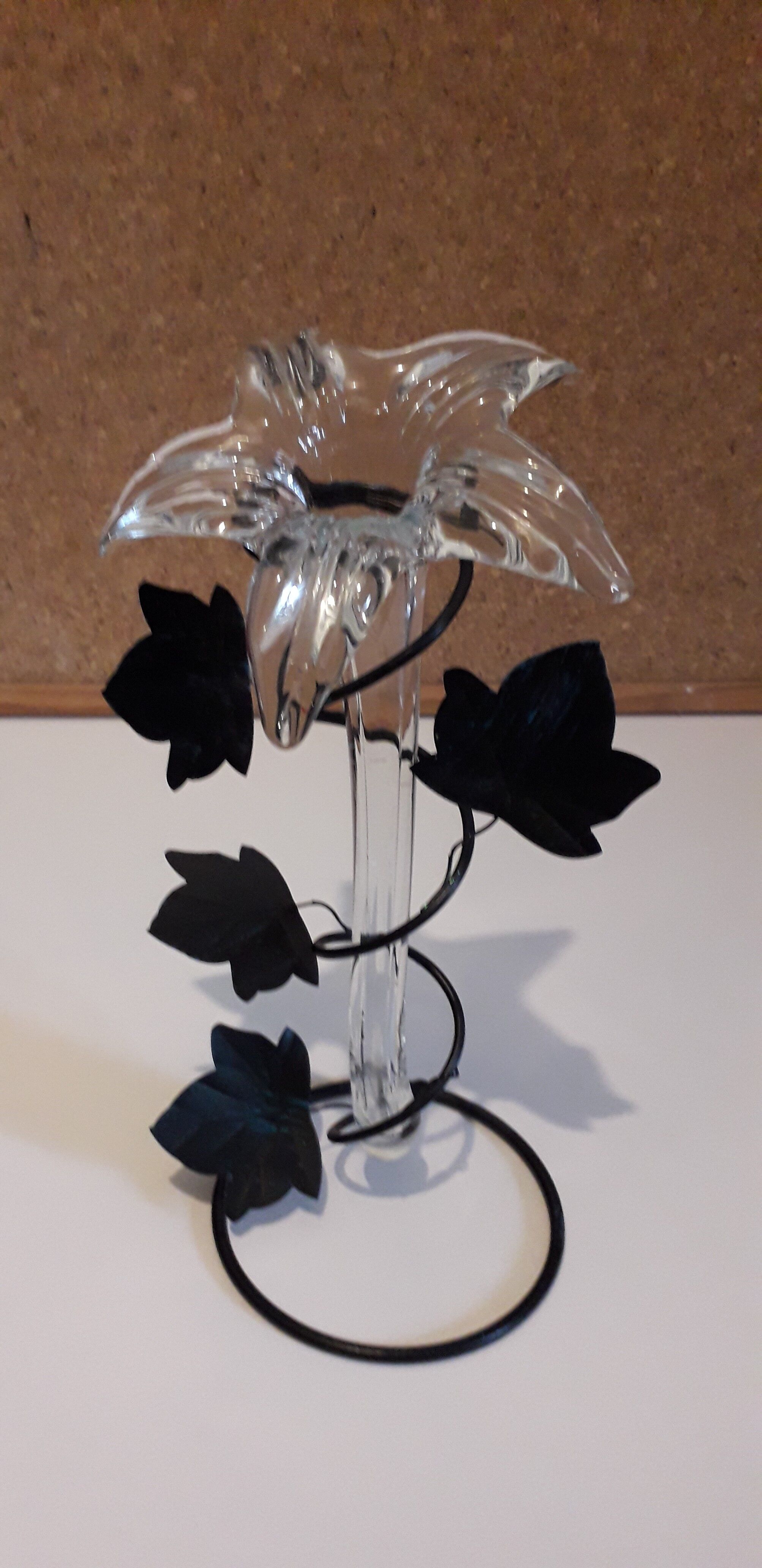 Glass soliflore vase in the shape of a fleur-de-lis on metal base