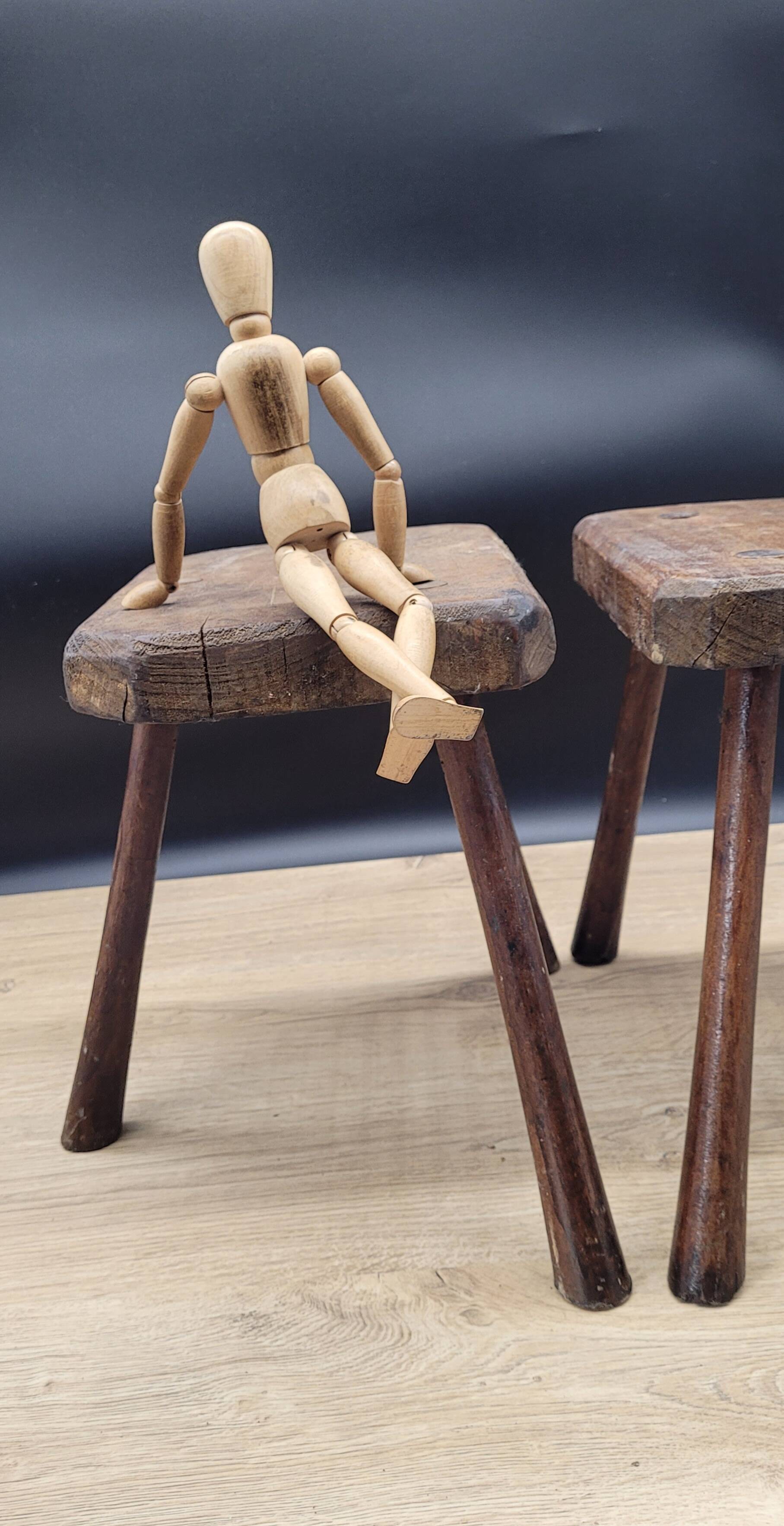 Pair of solid octagon cowhide tripod stools