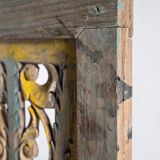 Rectangular Indonesian construction element with blue and yellow plant in carved wood