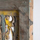 Rectangular Indonesian construction element with blue and yellow plant in carved wood