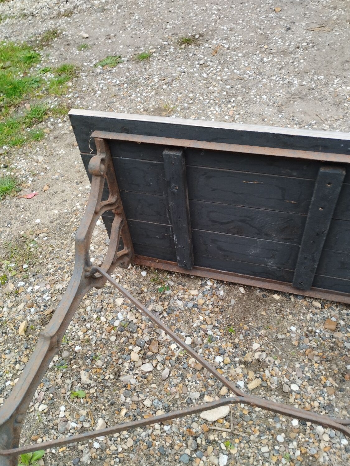 Antique bistro table with iron legs and wooden top