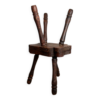Two three-legged wooden stools