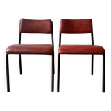 Pair of vintage stacking chairs with red vinyl upholstery