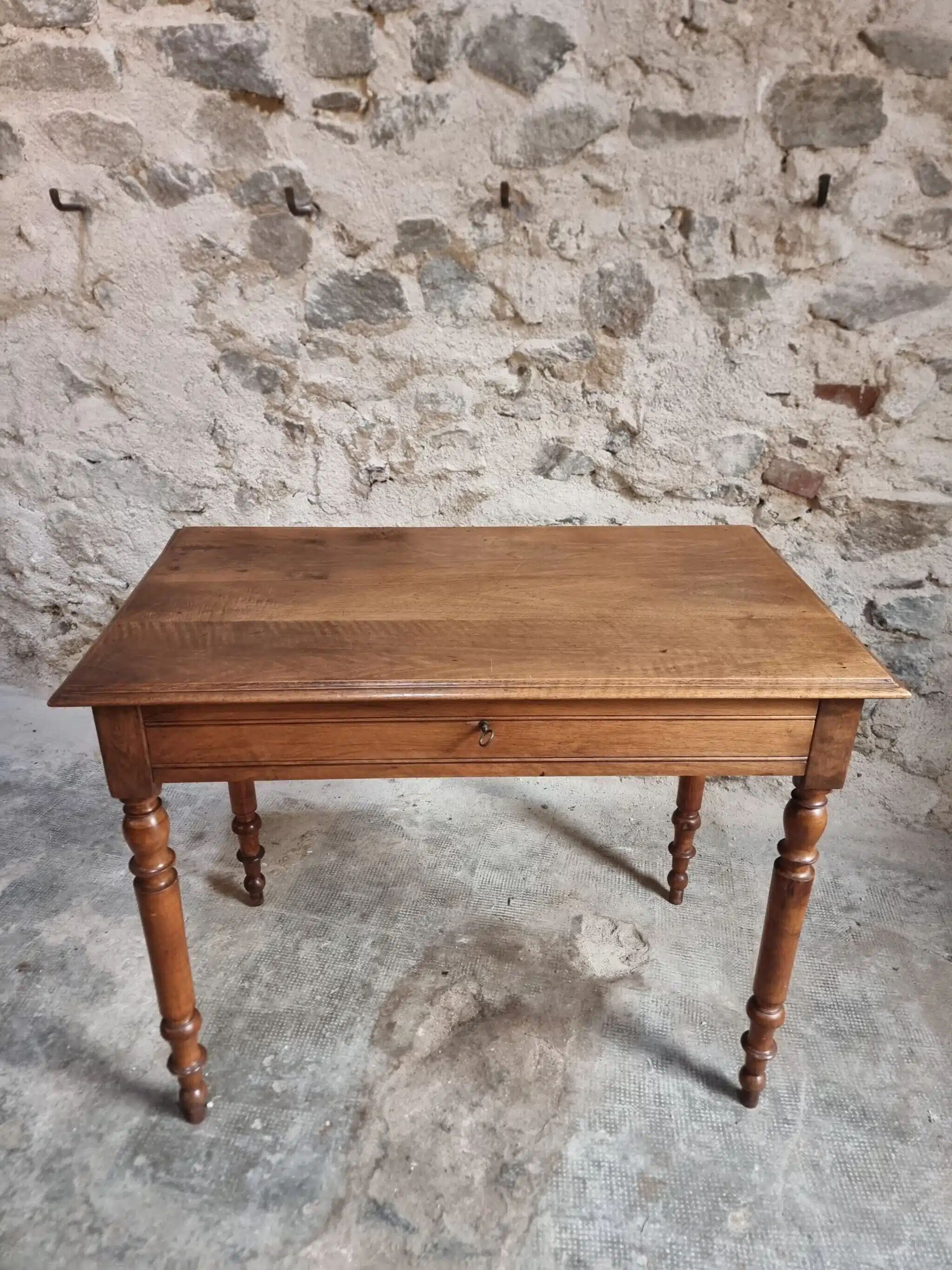 Antique French writing table in walnut with a drawer, circa 1900.