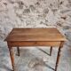 Antique French writing table in walnut with a drawer, circa 1900.