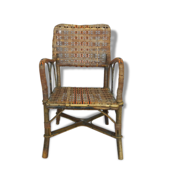 Small child vintage armchair in rattan