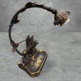 Metal table lamp with a deer on the front