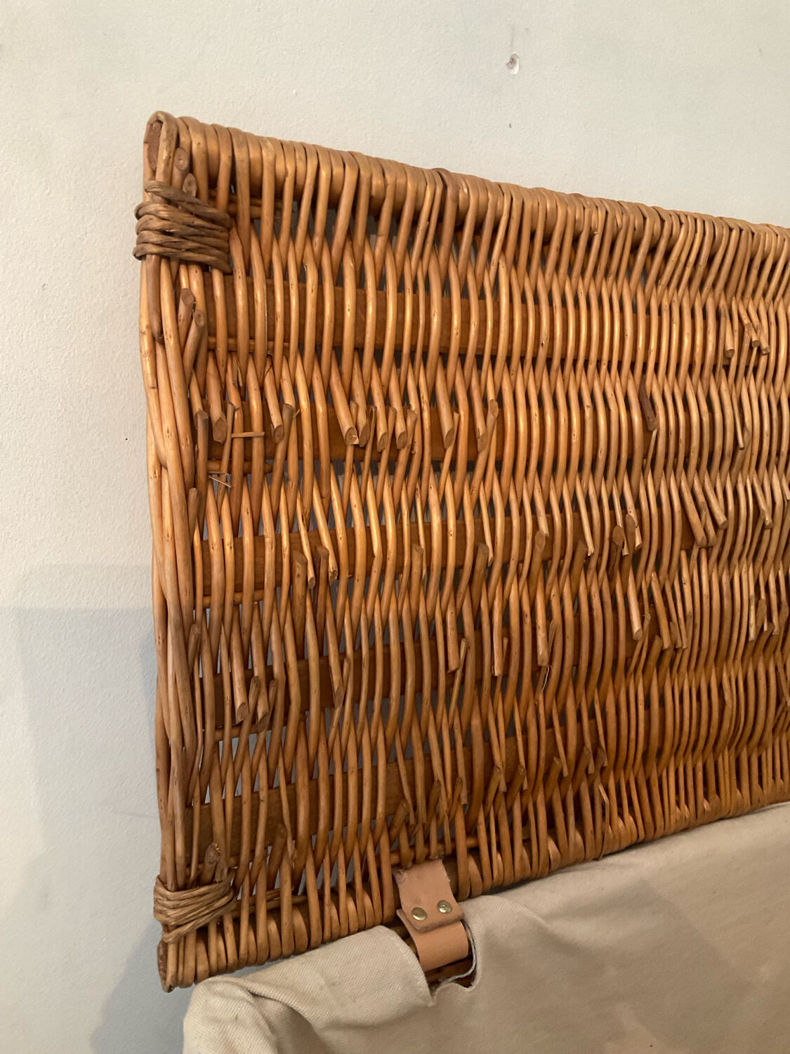 Woven wicker vintage suitcase